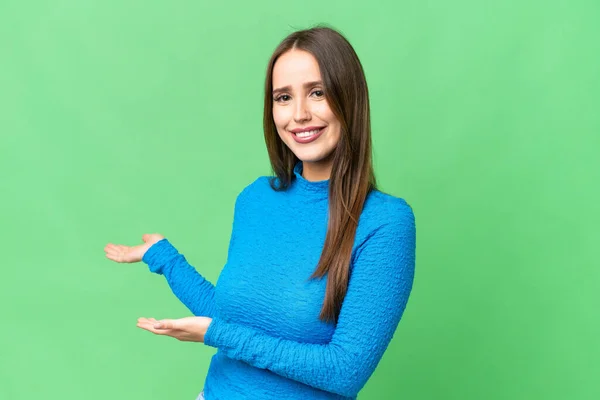 Young Beautiful Woman Isolated Chroma Key Background Extending Hands Side — Stockfoto