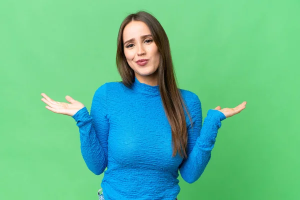 Young Beautiful Woman Isolated Chroma Key Background Making Doubts Gesture — Stockfoto
