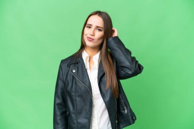 Young beautiful woman over isolated chroma key background having doubts