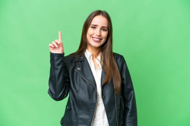 Young beautiful woman over isolated chroma key background pointing up a great idea