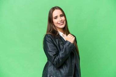 Young beautiful woman over isolated chroma key background proud and self-satisfied