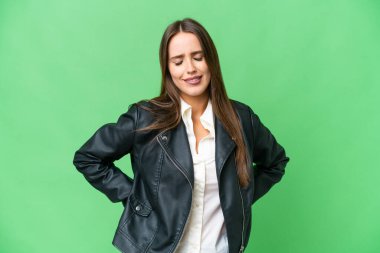 Young beautiful woman over isolated chroma key background suffering from backache for having made an effort