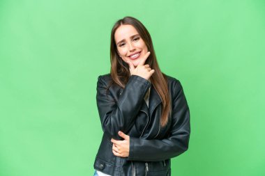 Young beautiful woman over isolated chroma key background happy and smiling