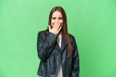 Young beautiful woman over isolated chroma key background happy and smiling covering mouth with hand