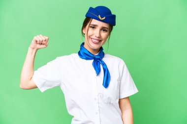 Airplane stewardess over isolated chroma key background doing strong gesture