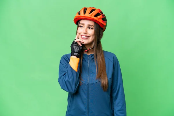 Young Cyclist Woman Isolated Chroma Key Background Thinking Idea While — Stockfoto
