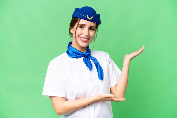 Airplane Stewardess Isolated Chroma Key Background Extending Hands Side Inviting — Photo