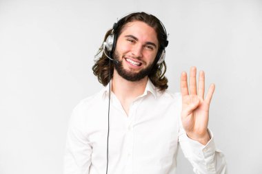 Telemarketer man working with a headset over isolated white background happy and counting four with fingers
