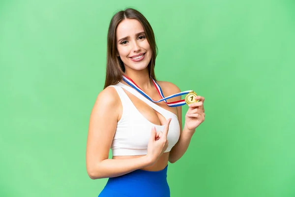Joven Hermosa Mujer Con Medallas Sobre Fondo Croma Clave Aislada —  Fotos de Stock