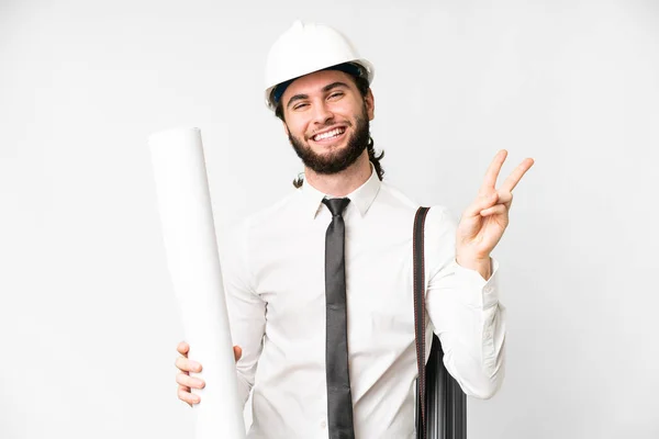 Young Architect Man Helmet Holding Blueprints Isolated White Background Smiling — Foto Stock