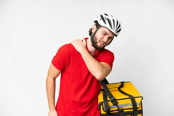 Young delivery man with thermal backpack over isolated white background suffering from pain in shoulder for having made an effort
