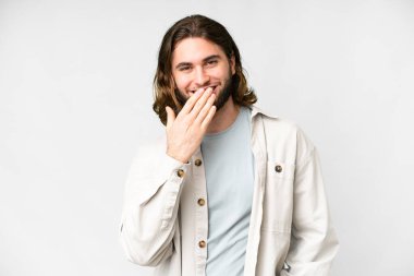 Young handsome man over isolated white background happy and smiling covering mouth with hand
