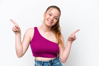 Young caucasian girl isolated on white background pointing finger to the laterals and happy