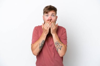 Redhead man with long beard isolated on white background covering mouth with hands