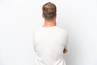Redhead man with long beard isolated on white background in back position