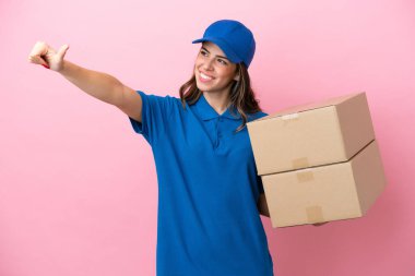 Delivery Italian woman isolated on pink background giving a thumbs up gesture