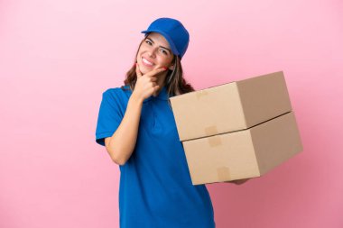 Delivery Italian woman isolated on pink background happy and smiling