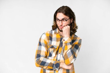 Young handsome man over isolated white background with tired and bored expression