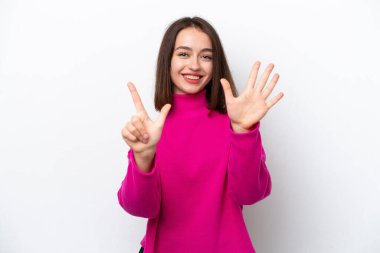Young Ukrainian woman isolated on white background counting seven with fingers