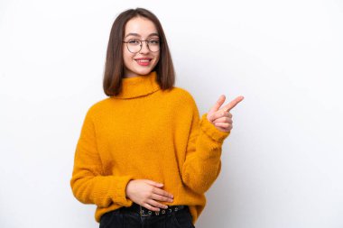 Young Ukrainian woman isolated on white background pointing finger to the side