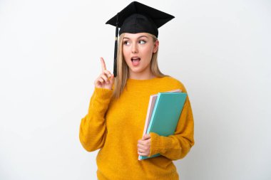Young student caucasian woman isolated on white background thinking an idea pointing the finger up