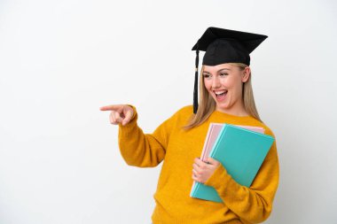 Young student caucasian woman isolated on white background pointing finger to the side and presenting a product
