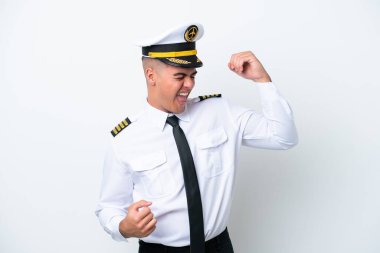 Airplane pilot caucasian man isolated on white background celebrating a victory