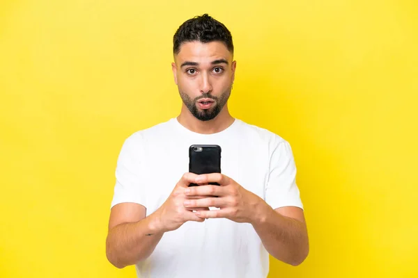 Young Arab Handsome Man Isolated Yellow Background Looking Camera While — 스톡 사진