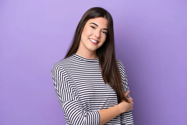 Young Brazilian woman isolated on purple background laughing