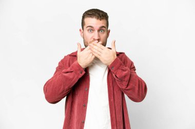 Young handsome blonde man over isolated white background covering mouth with hands