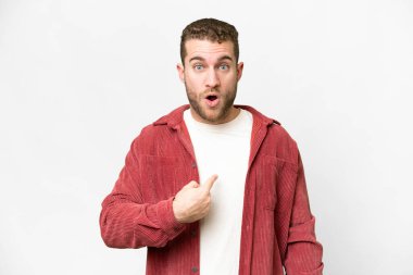 Young handsome blonde man over isolated white background pointing to oneself