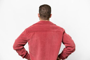 Young handsome blonde man over isolated white background in back position