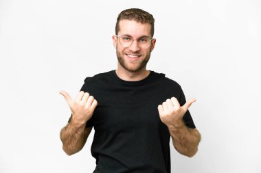 Young handsome blonde man over isolated white background with thumbs up gesture and smiling