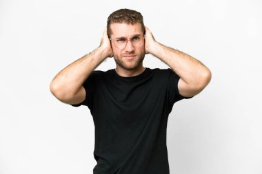 Young handsome blonde man over isolated white background frustrated and covering ears