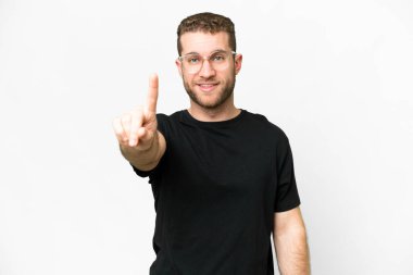Young handsome blonde man over isolated white background showing and lifting a finger
