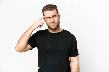 Young handsome blonde man over isolated white background making the gesture of madness putting finger on the head