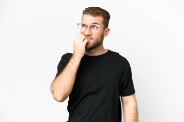 Young handsome blonde man over isolated white background is a little bit nervous