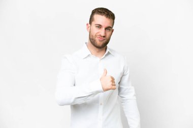 Young handsome blonde man over isolated white background proud and self-satisfied