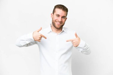 Young handsome blonde man over isolated white background proud and self-satisfied