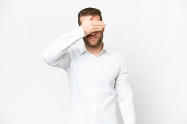 Young handsome blonde man over isolated white background covering eyes by hands. Do not want to see something