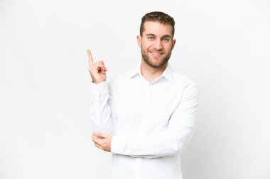 Young handsome blonde man over isolated white background happy and pointing up