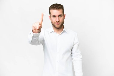 Young handsome blonde man over isolated white background counting one with serious expression