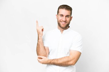 Young handsome blonde man over isolated white background happy and pointing up
