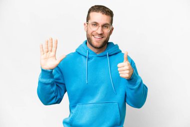 Young handsome blonde man over isolated white background counting six with fingers