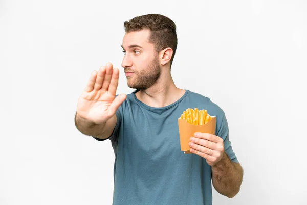 Young Handsome Blonde Man Holding Fried Chips Isolated White Background — Stok fotoğraf