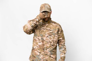 Military man over isolated white background covering eyes by hands. Do not want to see something