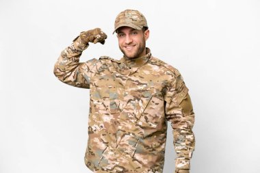 Military man over isolated white background doing strong gesture