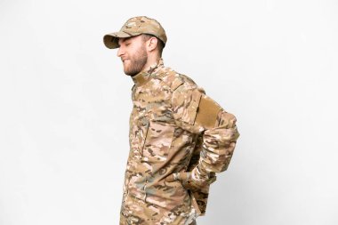 Military man over isolated white background suffering from backache for having made an effort
