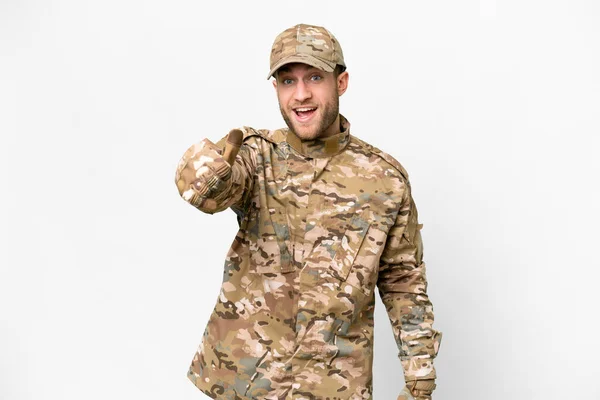 Military man over isolated white background with thumbs up because something good has happened