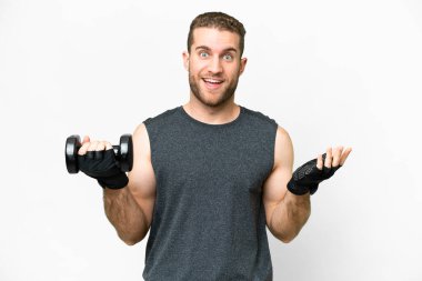 Young sport man making weightlifting over isolated white background with shocked facial expression